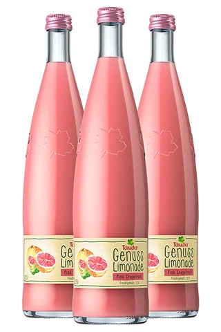 Drei Glasflaschen Teinacher Genuss Limonade Pink Grapefruit in der 0,75-Liter-Genussflasche