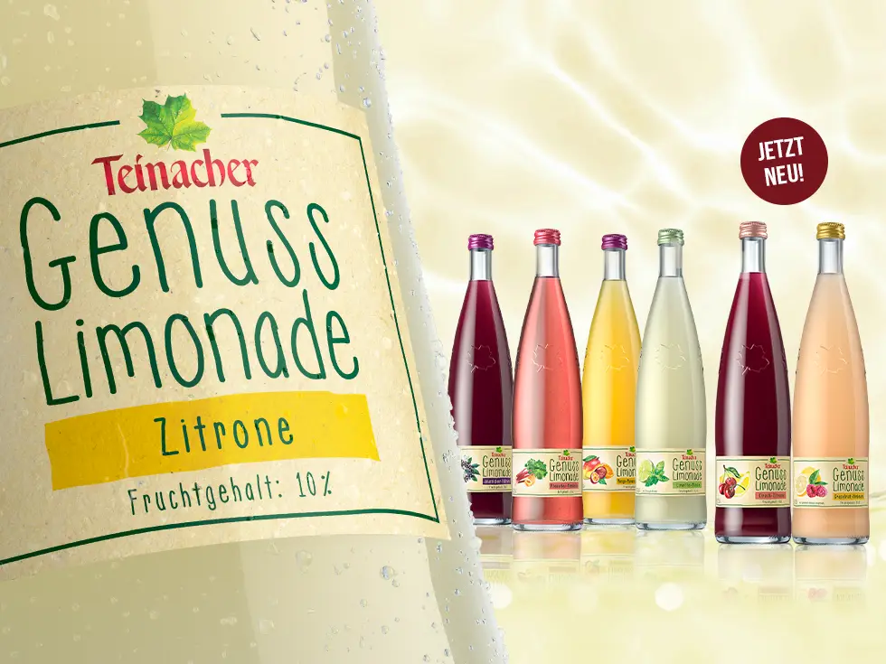 Sechs Teinacher Genuss-Limonaden in der 0,75 L Glas Genussflasche mit einer 0,75 L Glas Genuss-Limonaden Zitrone im Vordergrund