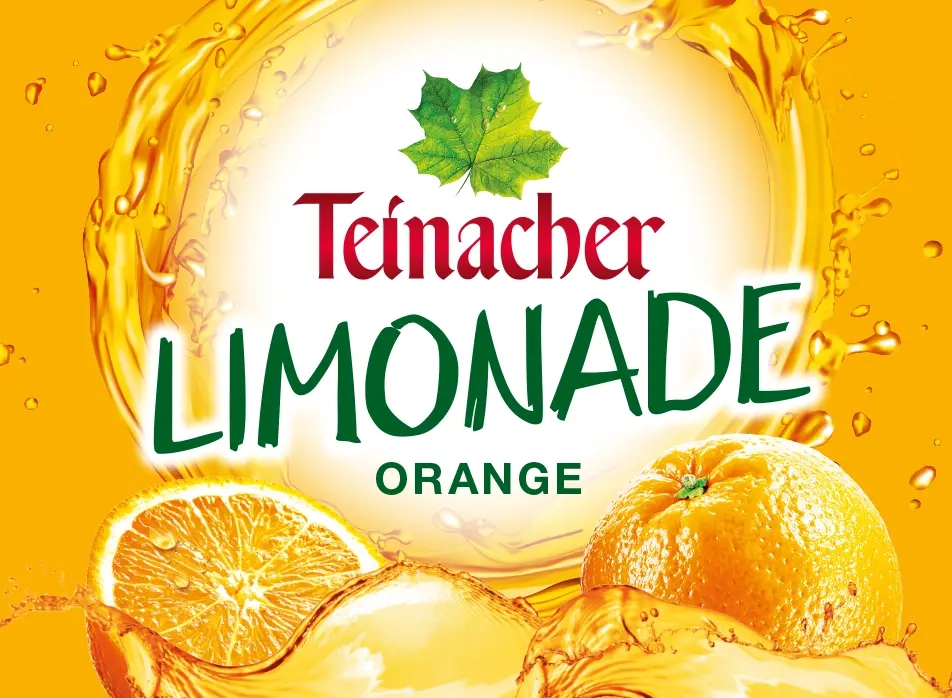 Etikett Teinacher Limonade Orange mit orangem Hintergrund und Orangenmotiv