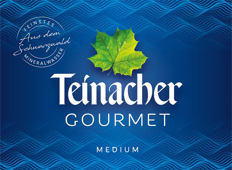 Etikett Teinacher Gourmet Medium Mineralwasser mit Kohlensäure und hellblauem Hintergrund