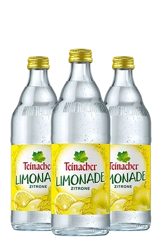 Drei 0,5-Liter-Glasflaschen Teinacher Limonade Zitrone mit spritzigem Inhalt und gelbem Etikett