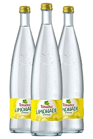 Drei 0,75-Liter-Glasflaschen Teinacher Limonade Zitrone mit spritzigem Inhalt und gelbem Etikett