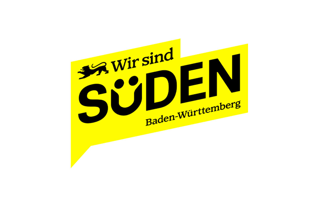 Logo „Wir sind Süden – Baden-Württemberg“ in gelber Sprechblase mit Löwen-Symbol und schwarzer Schrift